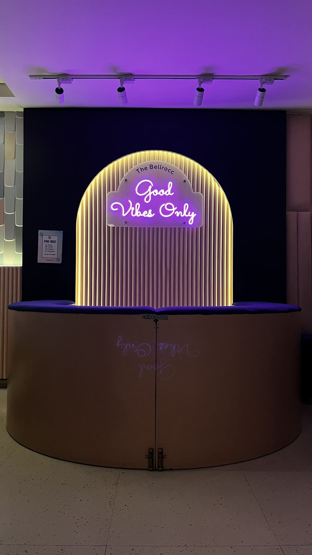 Neon 'Good Vibes Only' sign above the arched photo booth at The Bellrocc, Patiala